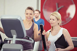 women working out on fitness equipment