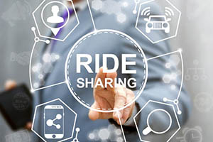 person pointing at a graphic for ride sharing
